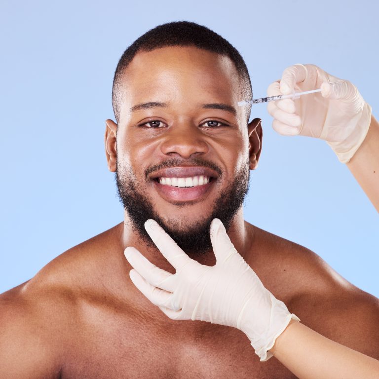 Needle, man and portrait for skincare, beauty process and filler in studio. Face of black male mode.
