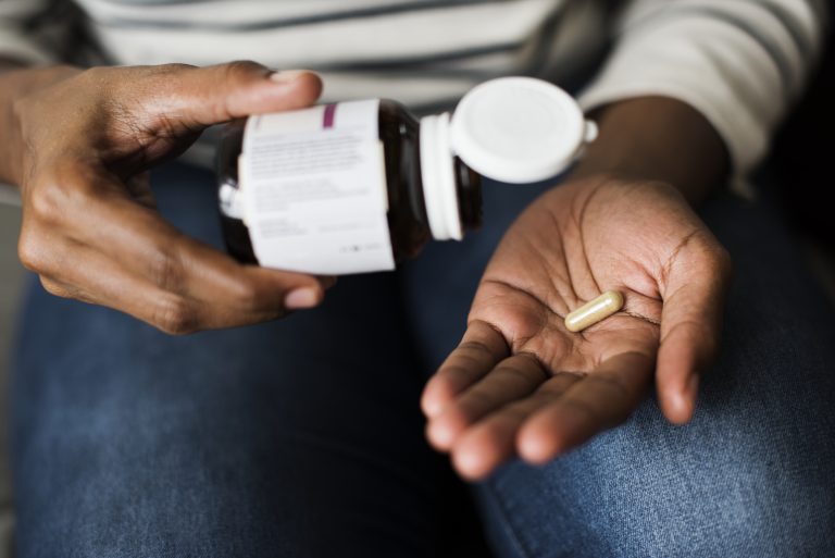 Woman taking pills for her health